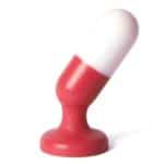 P-spot Plug: Plug anal y vaginal con forma de cápsula medicinal mitad roja, mitad blanca