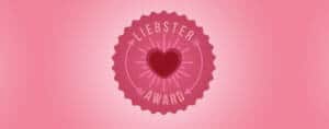 Logo de los premios Liebster Awards. Corazón sobre círculo rosa con la inscripción: Liebster Award