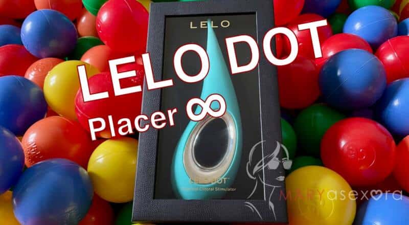 Portada del artículo "LELO Dot. Placer ∞" en el que se muestra el juguete en su caja en una piscina de bolas de colores con el título del artículo sobreimpreso en al imagen.