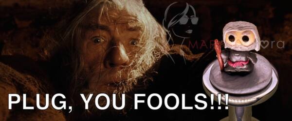 De fondo una imagen de Gandalf y en primer plano la figura de Gandalf del plug You shall not pass!